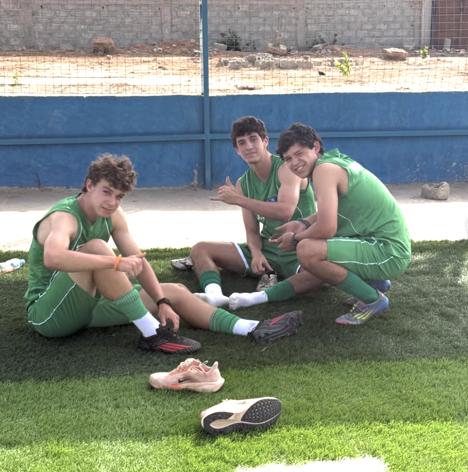 Three founders sitting on the turf