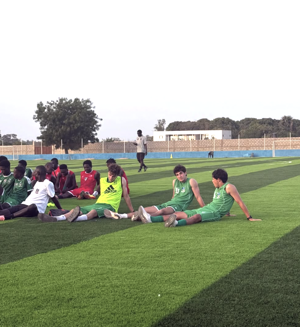 Players resting together on the pitch