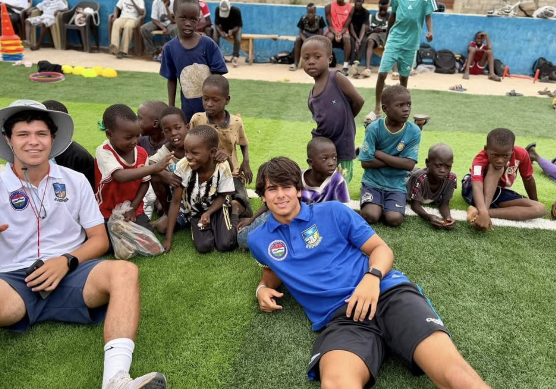Sitting with kids on the pitch