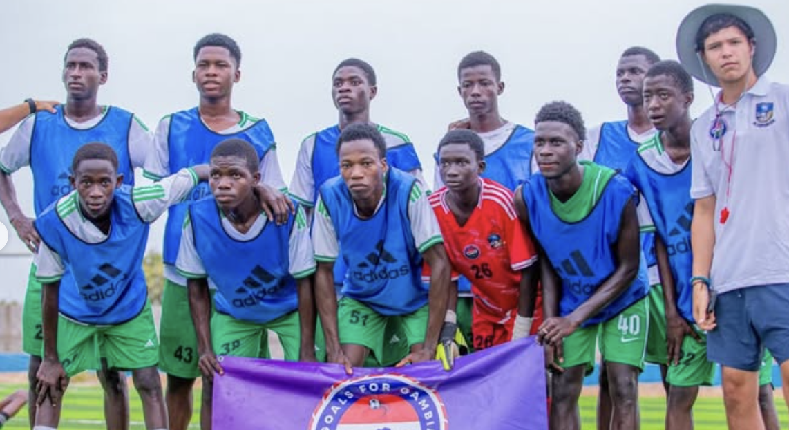 Winning team with Goals For Gambia banner