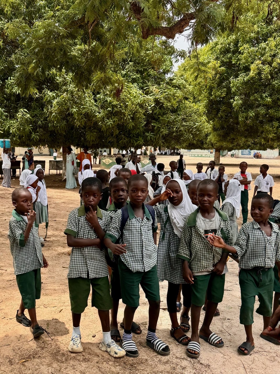 Schoolchildren in uniforms during a community visit