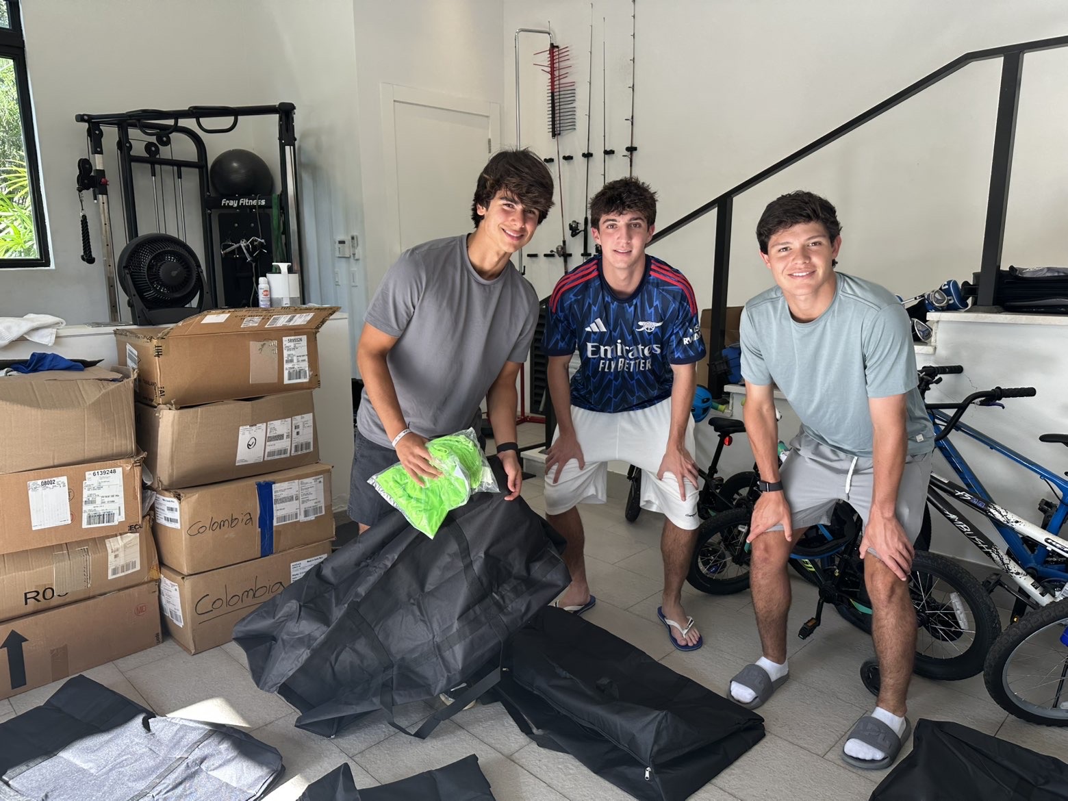 Group of volunteers packing bags with donated clothing